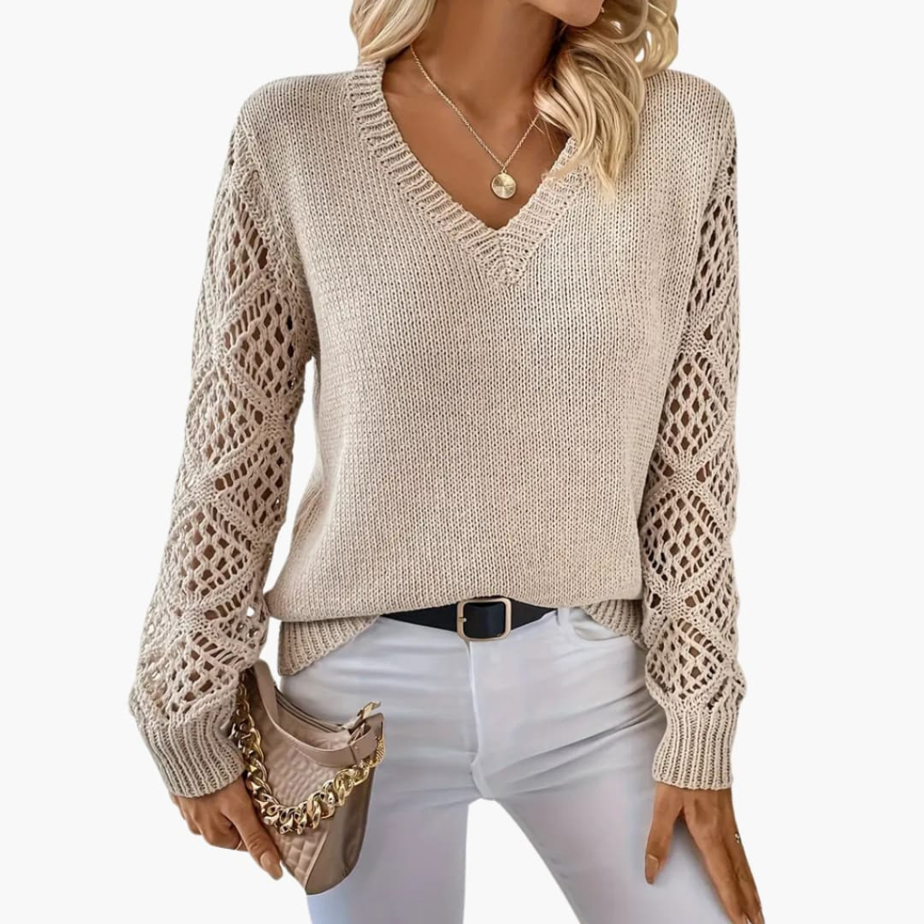 Elegant women's V-neck pullover with chic open sleeves, offering a comfortable, relaxed fit.