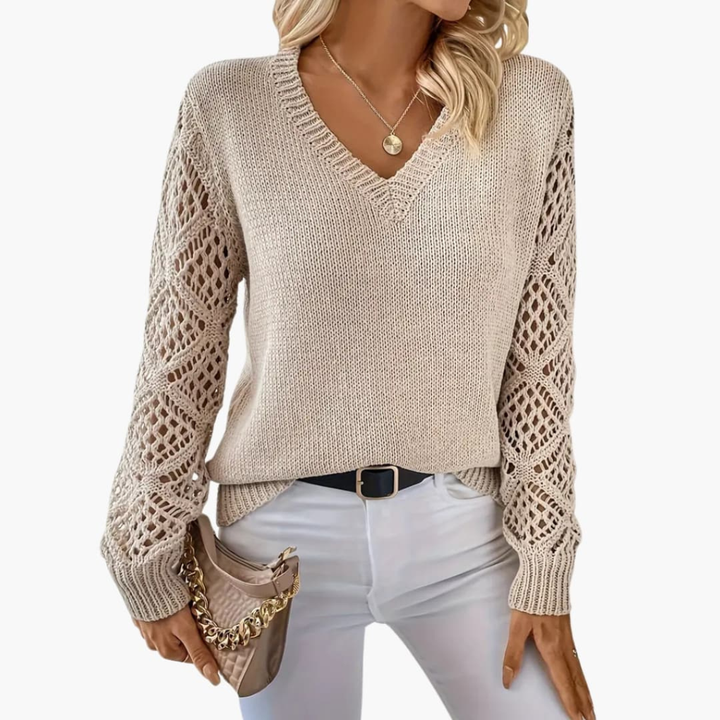 Elegant women's V-neck pullover with chic open sleeves, offering a comfortable, relaxed fit.