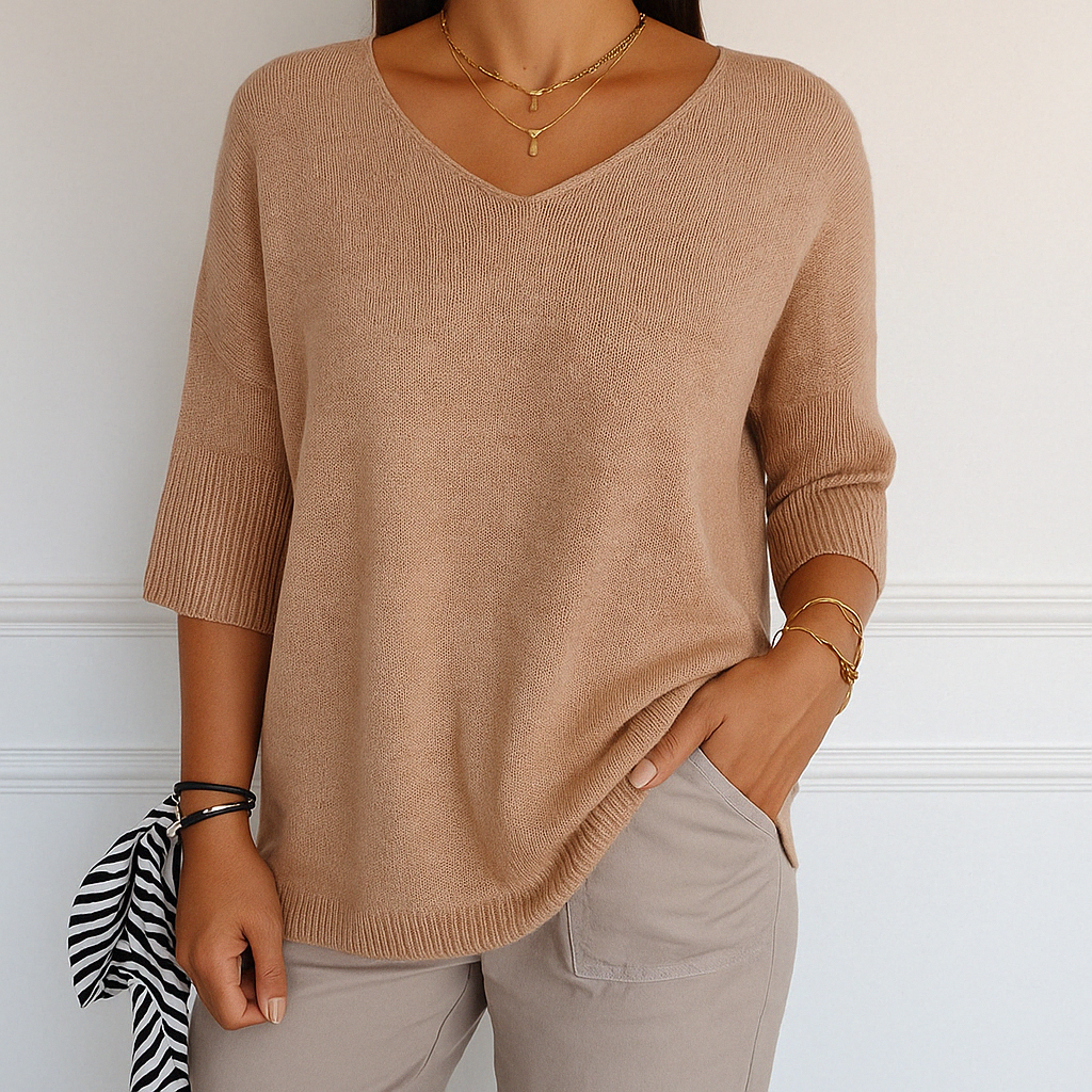 Fashionable women's V-neck short sleeve lightweight sweater in black, relaxed fit knitwear.