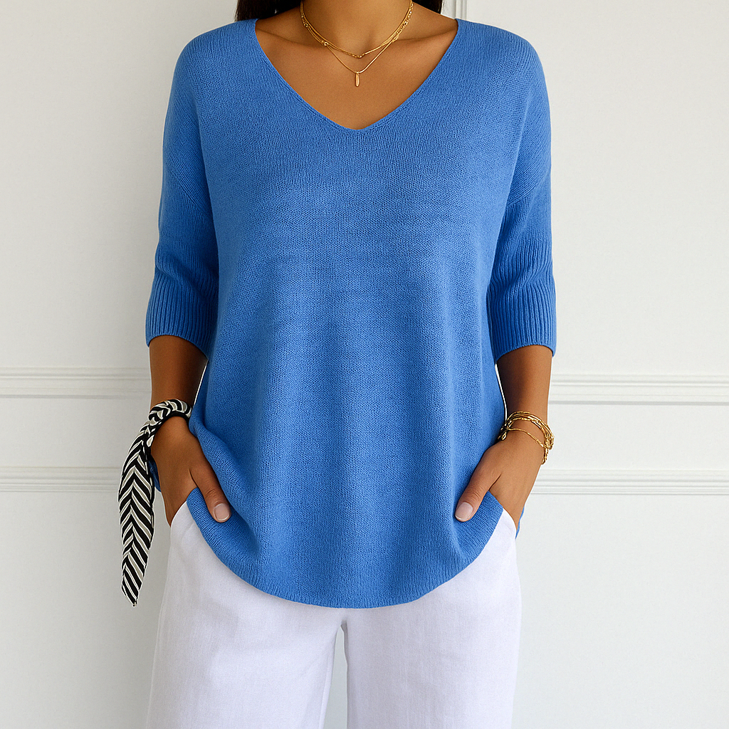 Stylish women's V-neck short sleeve lightweight sweater in a soft pastel shade for summer fashion.