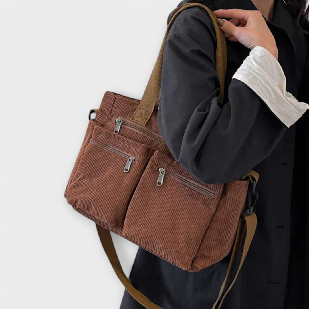 Spacious women's travel tote bag with durable straps, perfect for weekend trips and daily use