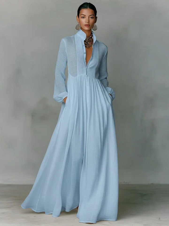 Versatile women's maxi shirt dress for day or office, featuring stand collar, button front & pockets.