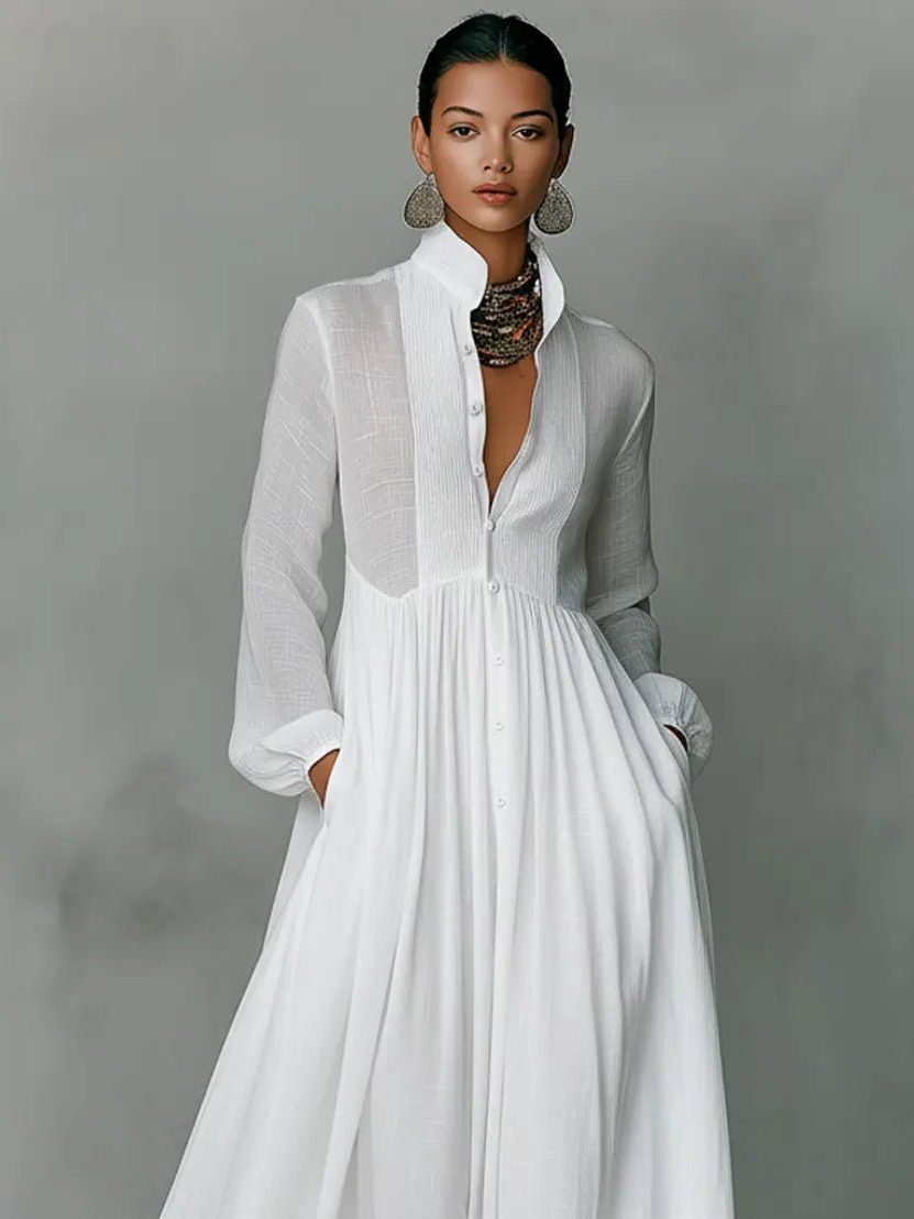 Chic women's maxi shirt dress with stand collar, long sleeves, button front, and convenient side pockets.