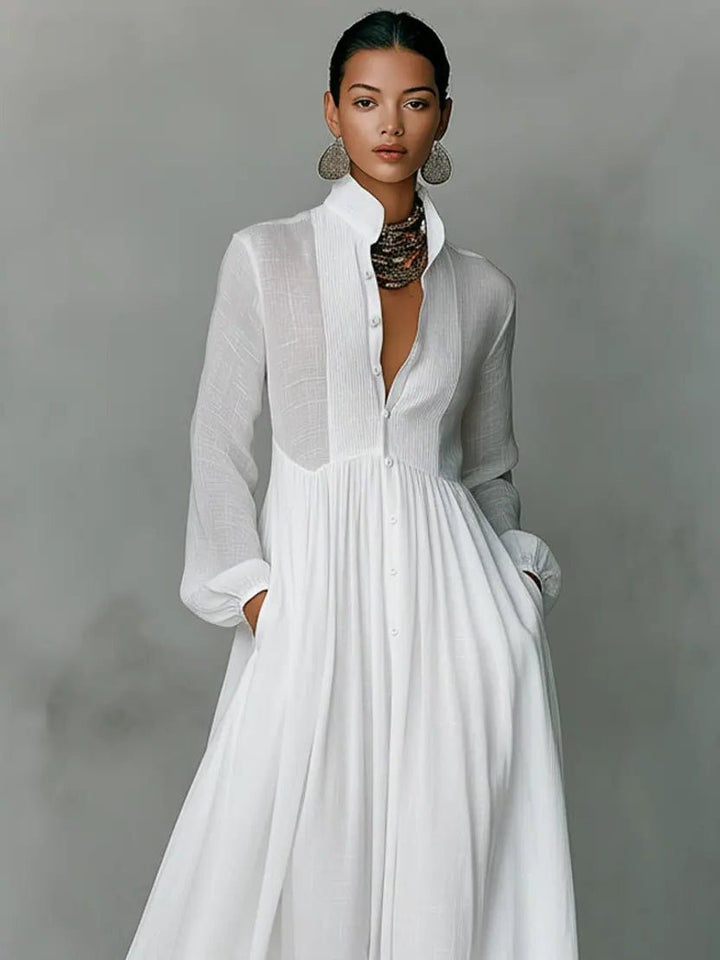 Chic women's maxi shirt dress with stand collar, long sleeves, button front, and convenient side pockets.