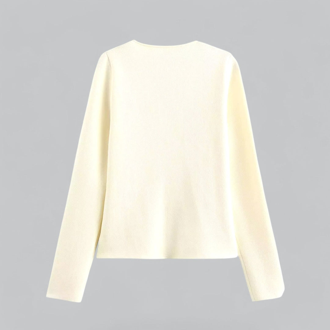 Minimalist women's button cardigan in a soft fabric, perfect for layering over spring fashion casualwear