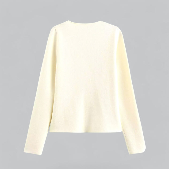 Minimalist women's button cardigan in a soft fabric, perfect for layering over spring fashion casualwear