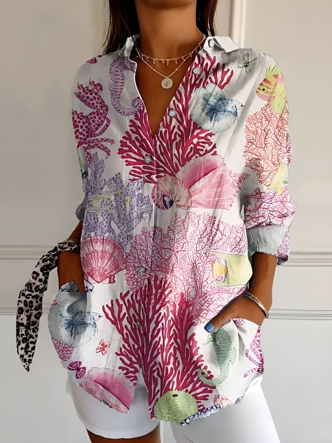 Effortless summer style with this women's vibrant floral button-front blouse, great for casual wear.