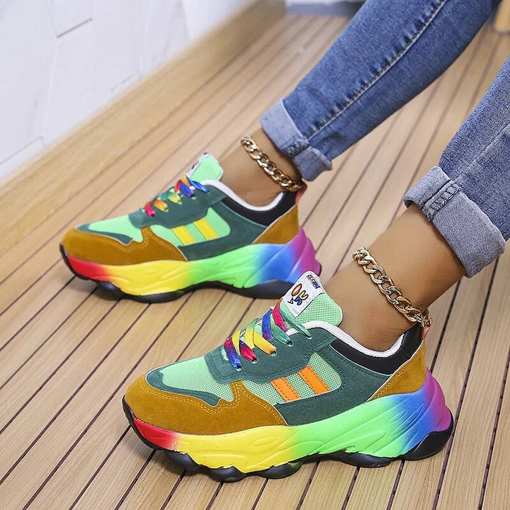 Women's vibrant rainbow orthopedic shoes with arch support & wide toe box for stylish, comfortable walking.
