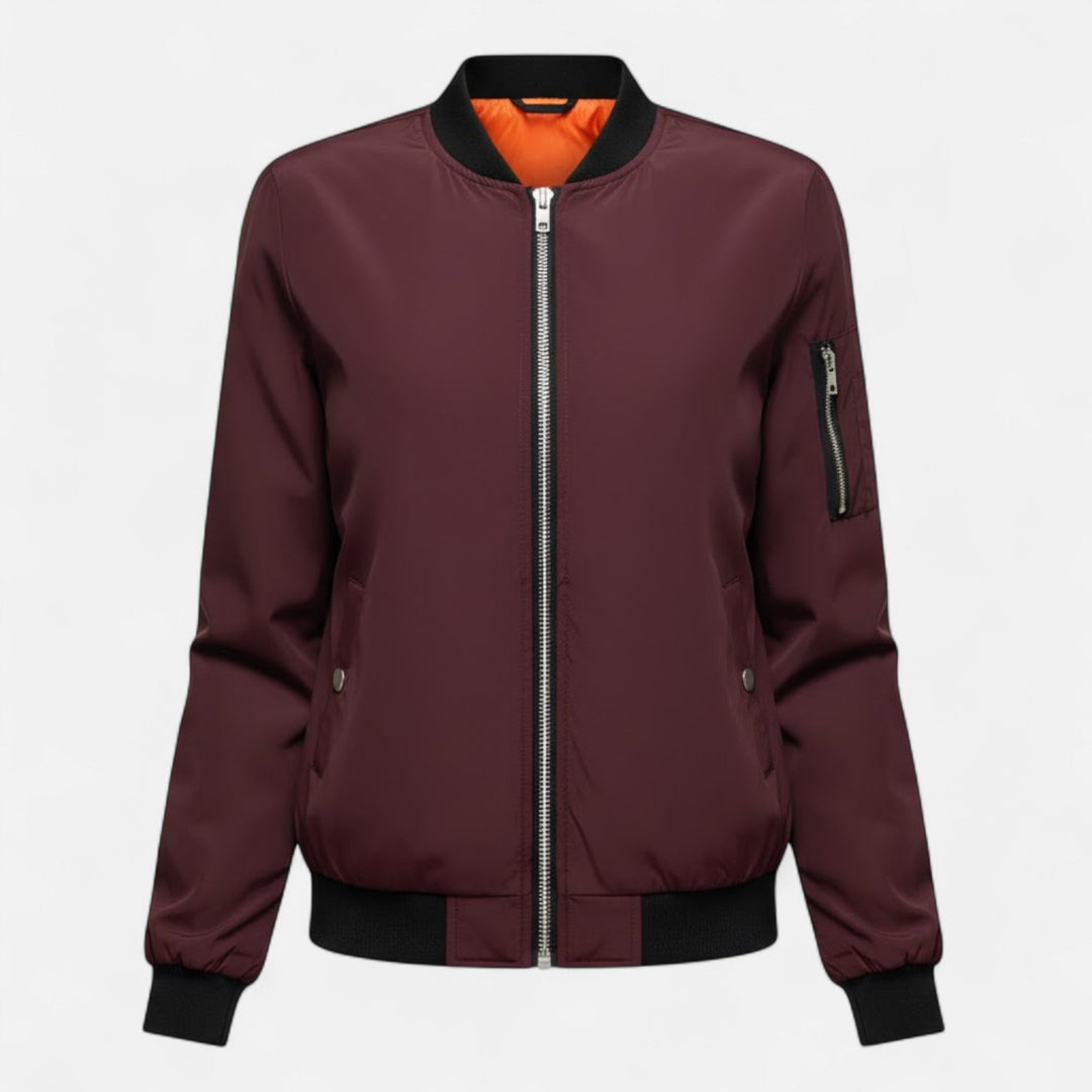 Model wearing a women's vintage bomber jacket, solid color, comfortable & stylish outerwear.