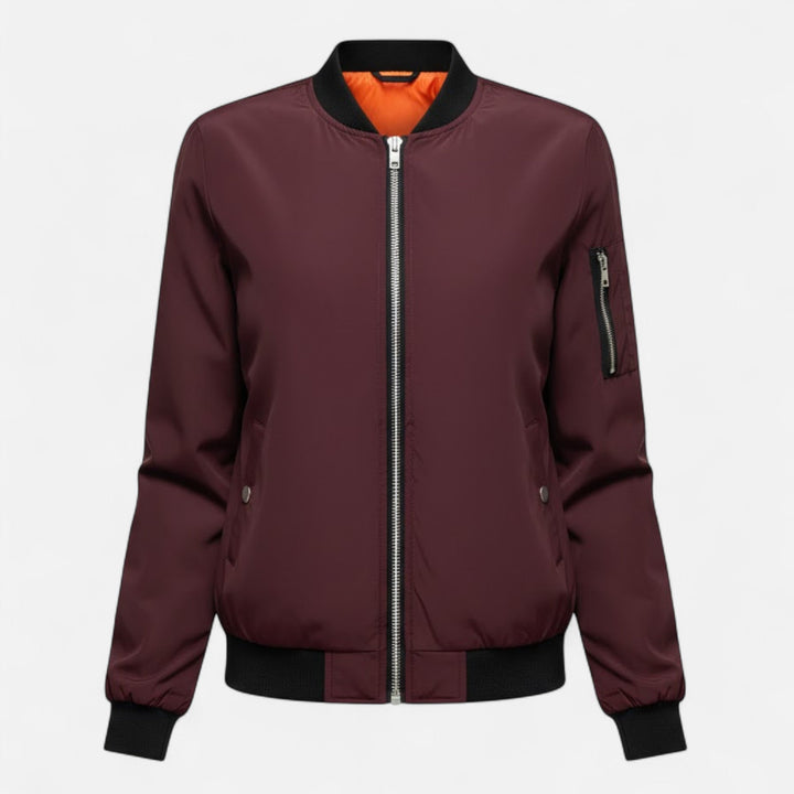 Model wearing a women's vintage bomber jacket, solid color, comfortable & stylish outerwear.