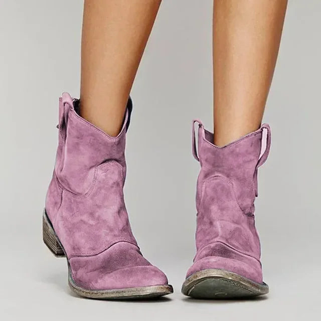 Model wearing women's vintage cowboy suede ankle boots, showcasing western fashion footwear