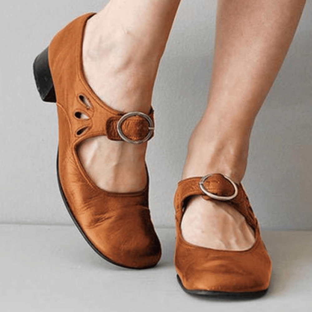 Comfortable PU leather women's vintage shoes with a subtle low heel and stylish buckle design.