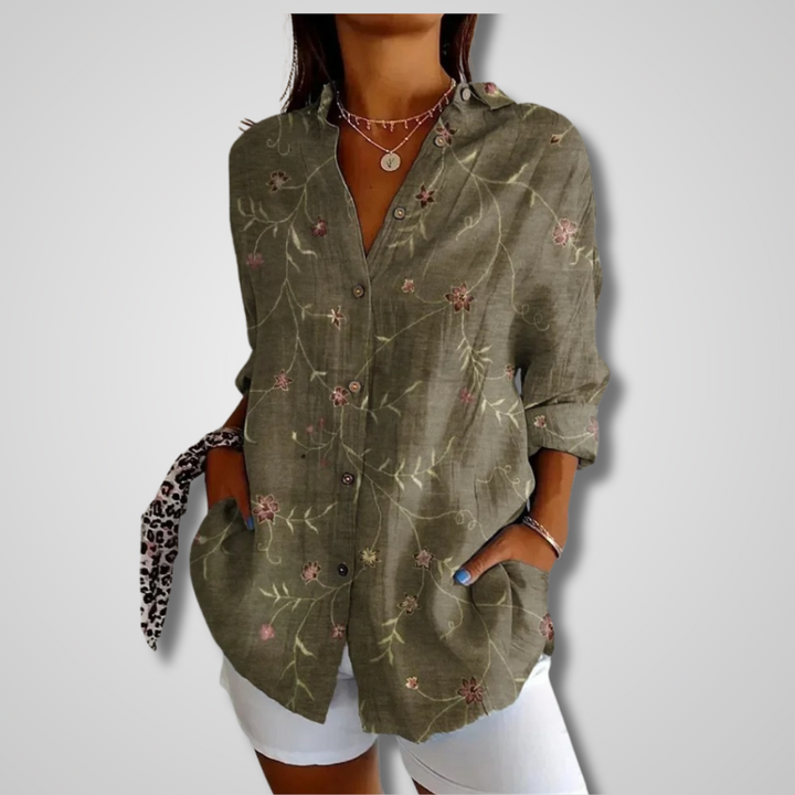 Close-up of a women's vintage relaxed button-up shirt with interesting fabric texture, ideal for casual wear.