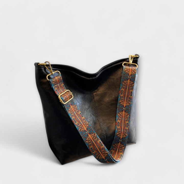 Elegant slouchy shoulder bag for women, vintage design with unique embroidered strap detail