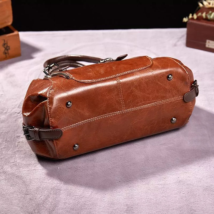 Red women's vintage handbag, an elegant shoulder bag made from vegan leather, a classic accessory for daily use.