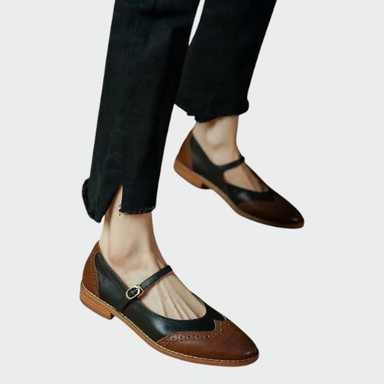 Close-up of women's two-tone Mary Jane shoes with strap, comfortable vintage design