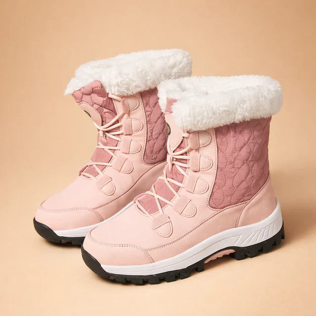 Durable women's winter boots, insulated for warmth in snow. Non-slip sole for outdoor safety & comfort. Fashionable design.