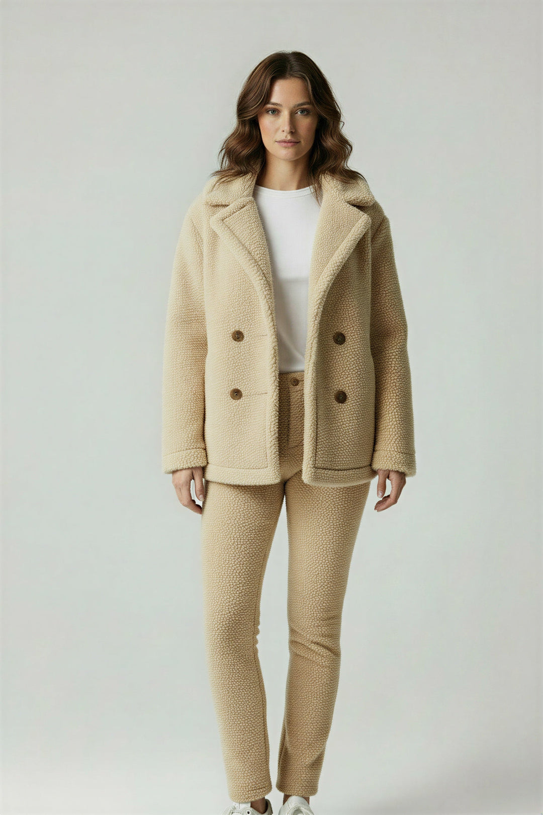 Woman wearing a stylish oversized winter coat, perfect for urban everyday wear. Warm, cozy & fashionable outerwear.