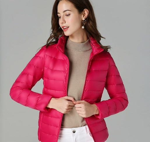 Stylish women's quilted puffer jacket in a cozy design, ideal for fashionable winter wear and comfort.
