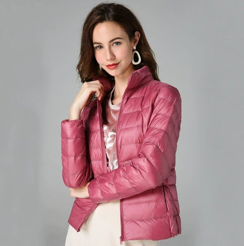 Fashionable women's quilted puffer jacket, essential long sleeve outerwear for stylish winter comfort and warmth.