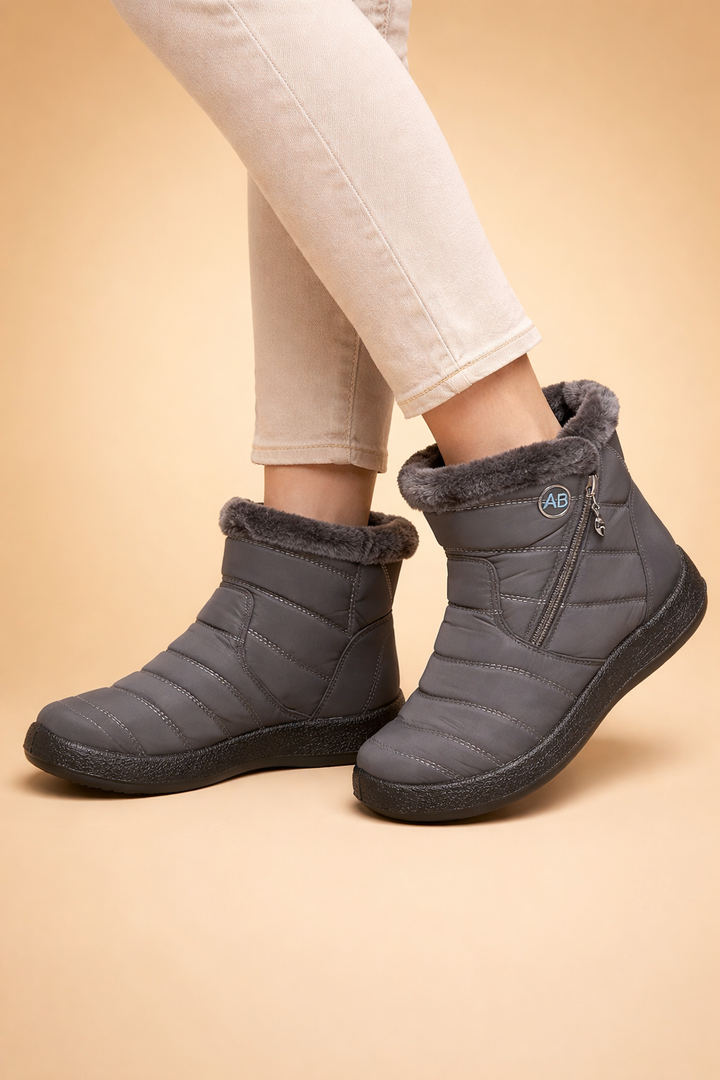 Red women's ankle boots, ideal for winter warmth, comfort, and casual everyday wear.