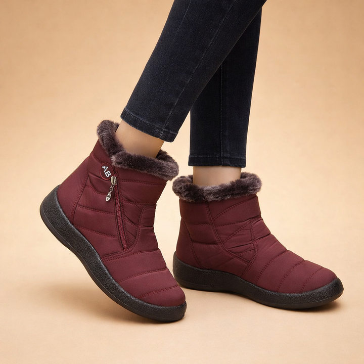 Brown women's warm winter ankle boots, cozy and comfortable slip-on footwear.