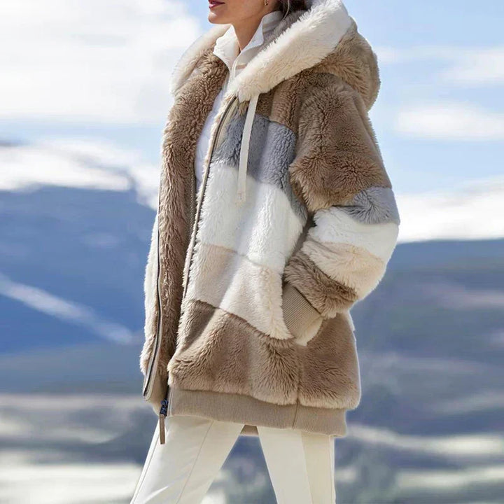 Close-up of fleece lining in a women's cold weather winter coat, zip up design
