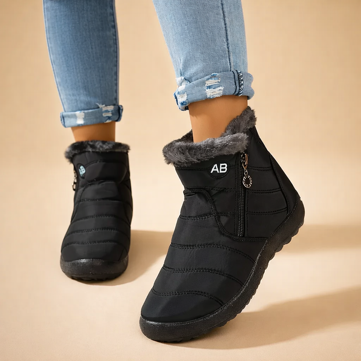 Stylish women's cozy winter ankle boots with convenient zip-up closure, perfect for casual cold weather fashion.