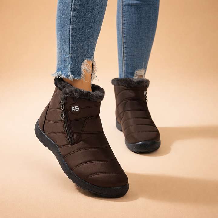 Soft fleece-lined women's warm winter boots, ideal zip-up ankle booties for cozy comfort in cold weather.