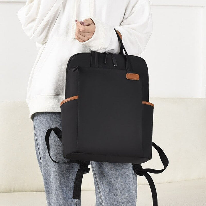 Close-up of the water-resistant Oxford fabric on women's anti-theft travel backpack, durable and sleek.