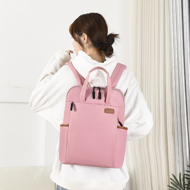 Ergonomic women's anti-theft travel backpack, water-resistant Oxford design, comfortable for long wear.