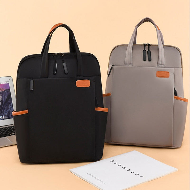 Compact women's water-resistant anti-theft backpack, ideal for secure daily commuting and travel.