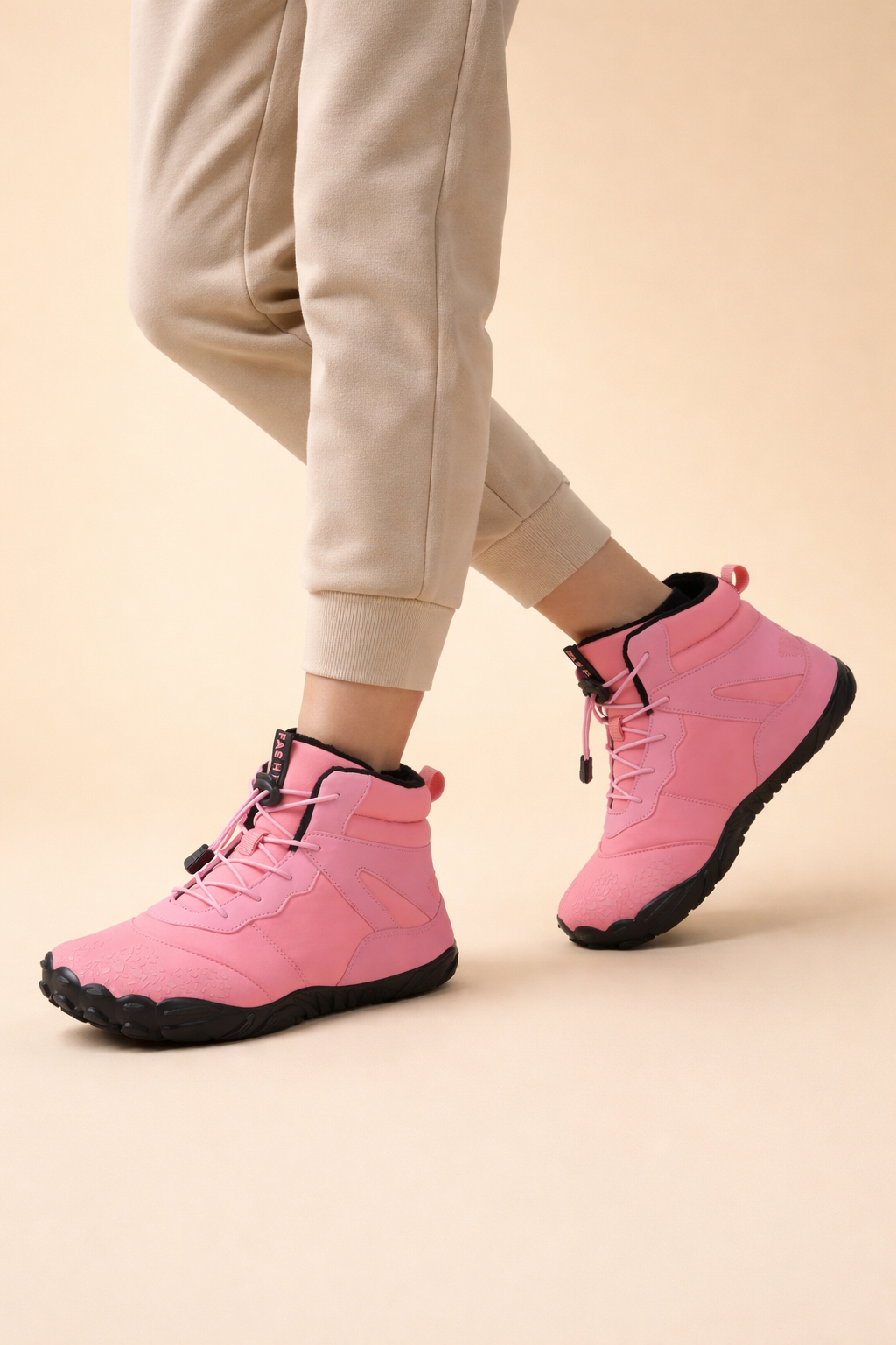 Minimalist women's waterproof barefoot winter boots, flexible & comfortable for natural movement in cold weather.