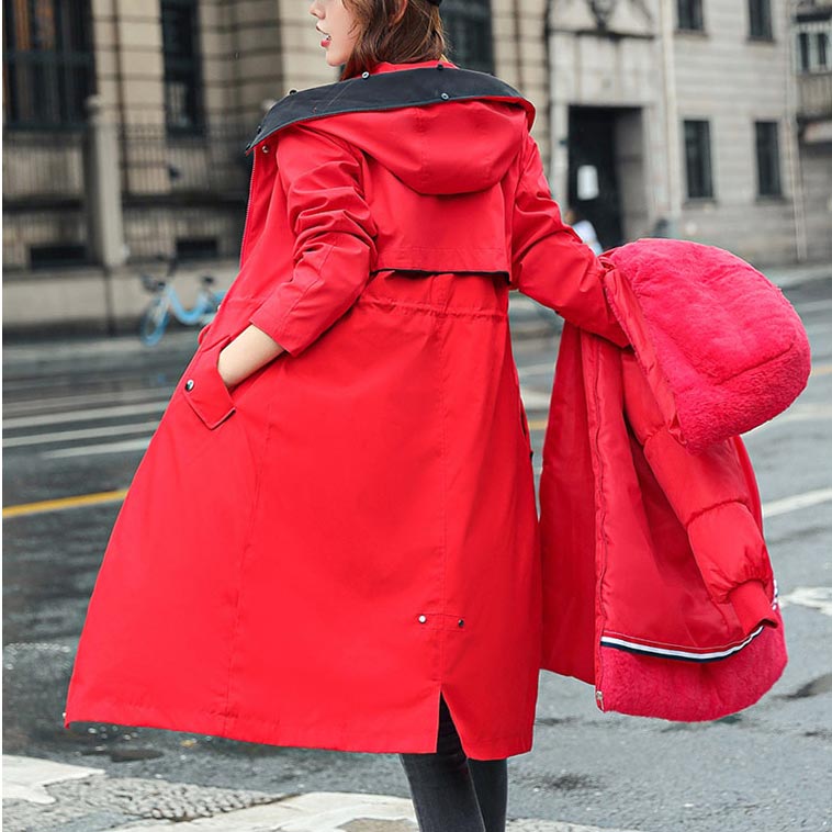 Outdoor women's waterproof jacket with hood, lightweight for comfortable all-season use.