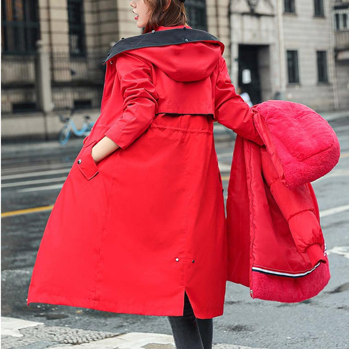 Outdoor women's waterproof jacket with hood, lightweight for comfortable all-season use.