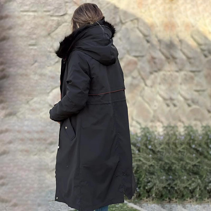 All-season women's waterproof jacket with hood, providing ultimate weather protection.