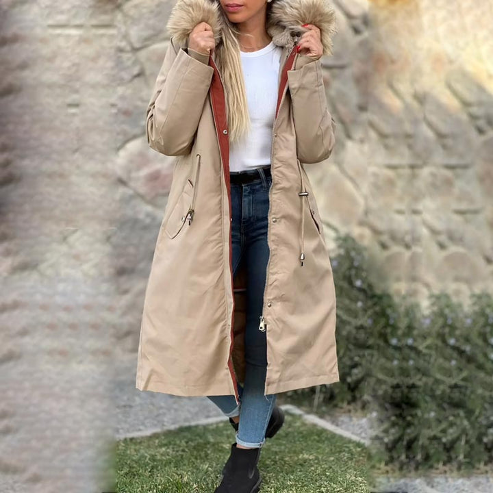 Stylish women's lightweight waterproof hooded jacket, versatile for all-season outdoor activities.