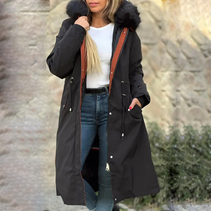 Casual women's waterproof coat with hood, perfect for all-season outdoor adventures.