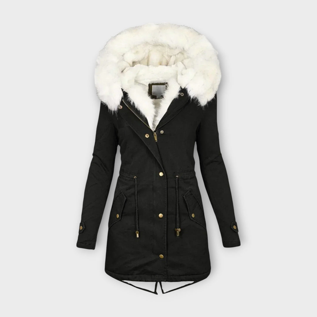 Long women's waterproof parka with a cozy faux fur-lined hood, ideal for cold weather.