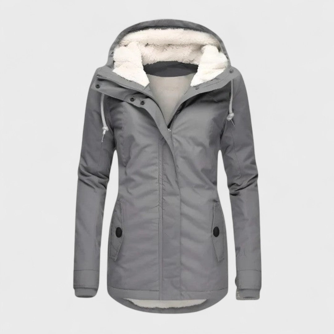 Women's waterproof winter parka with faux fur hood, providing warmth & protection for cold weather.