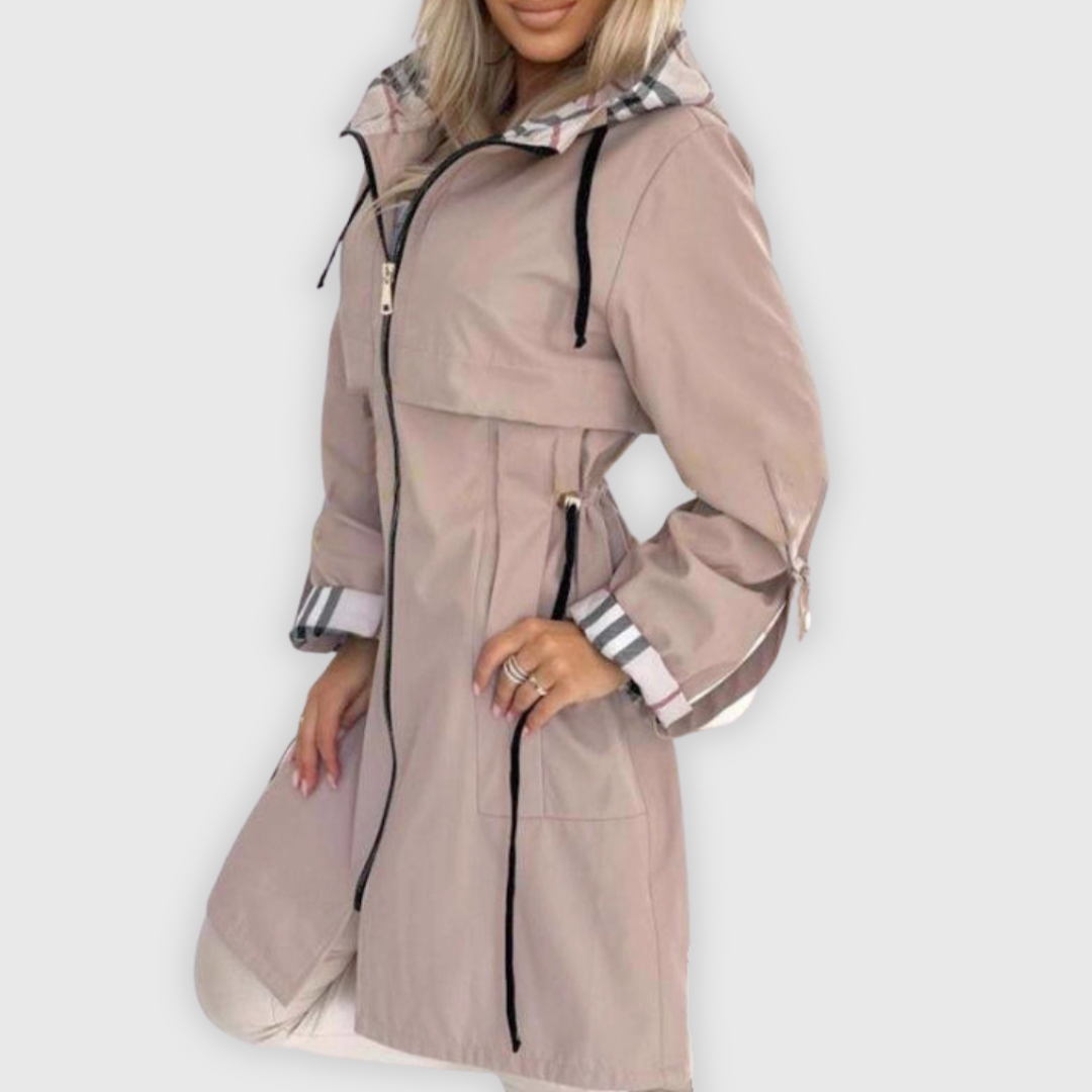 Women's wind-resistant zip-up coat in a vibrant color, great for outdoor activity