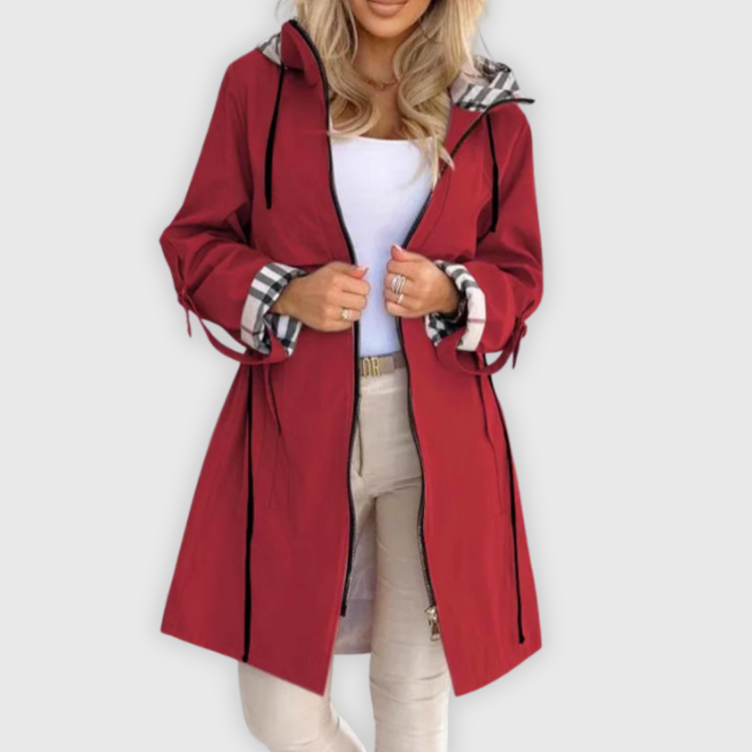 Full shot of a woman wearing a functional and fashionable waterproof zip-up jacket