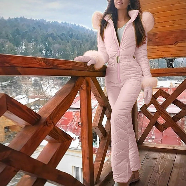 Women's winter overall suit, designed for comfort & protection on the slopes. Features weather-resistant fabric.