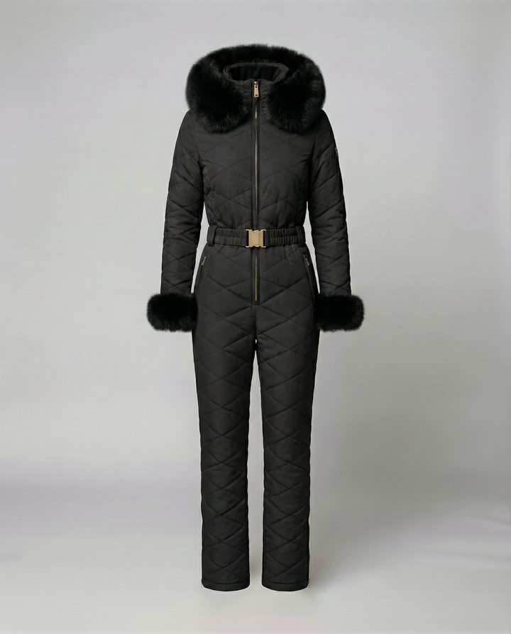 Empowering women's winter jumpsuit, ideal for snowboarding & outdoor activities. Weather-resistant for cold conditions.