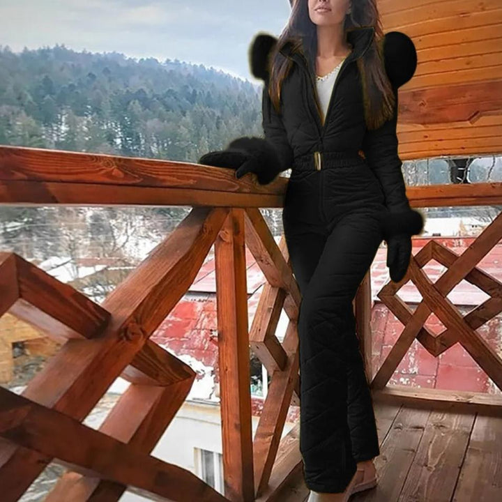High-performance women's snowboard overall suit. This weather-resistant winter jumpsuit ensures warmth & durability.