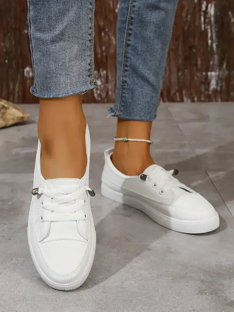 Stylish women's round toe lace-up flats in white, ideal casual footwear for versatile everyday walking.