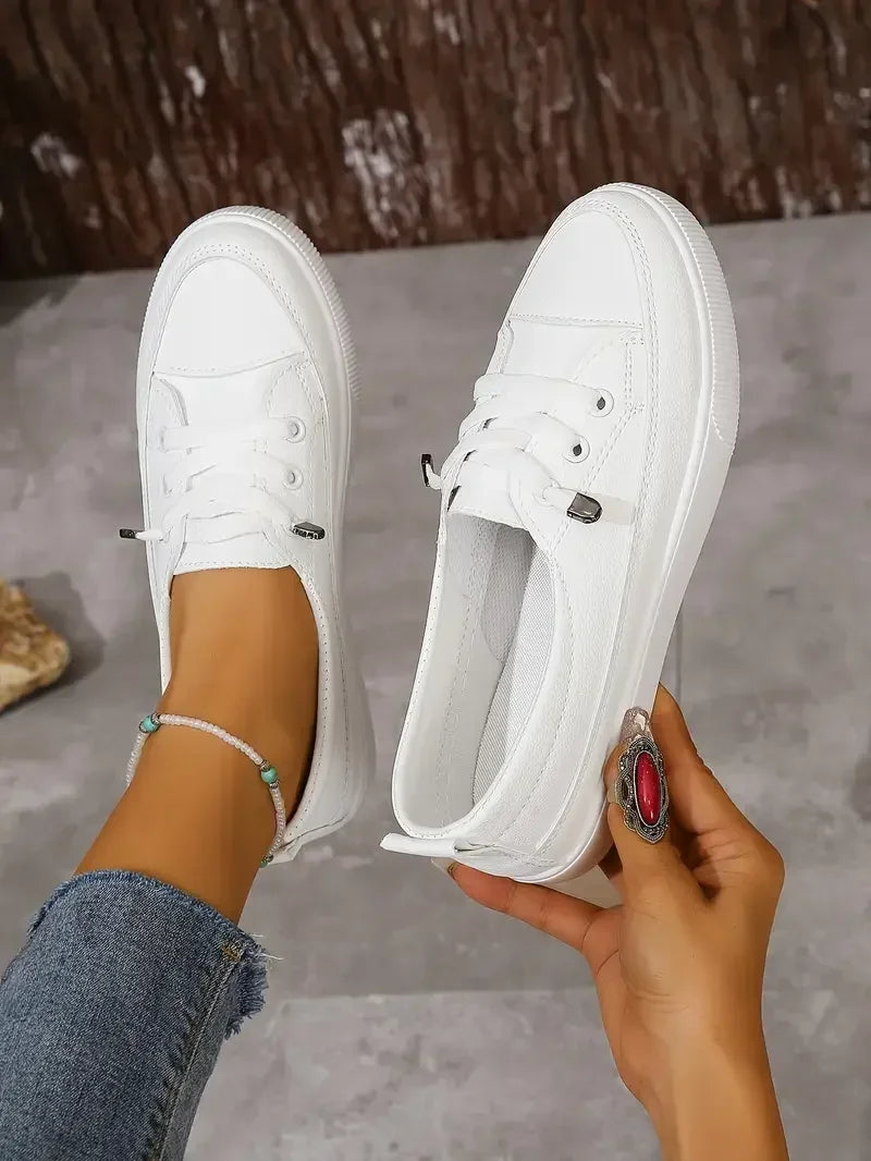 White women's lace-up casual flats with a comfortable round toe, versatile footwear for everyday style.