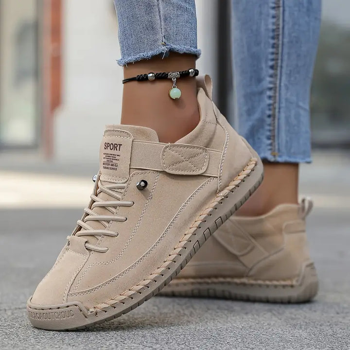 Stylish women's platform sneakers with lace-up detail, offering comfort and trendy style.