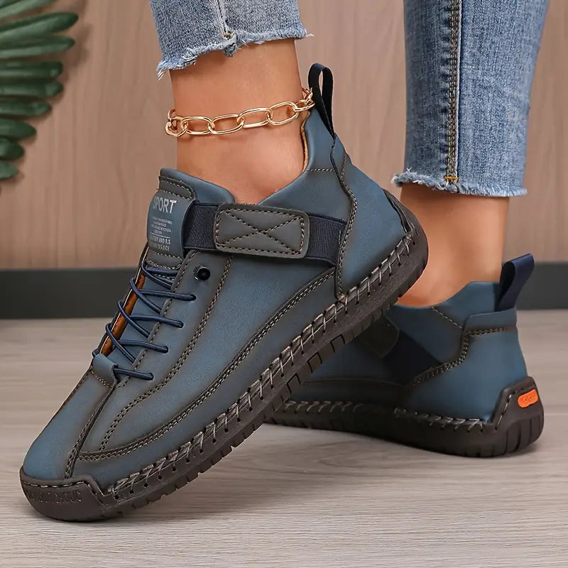 Fashionable women's white platform sneakers, comfortable lace-up footwear for casual occasions.