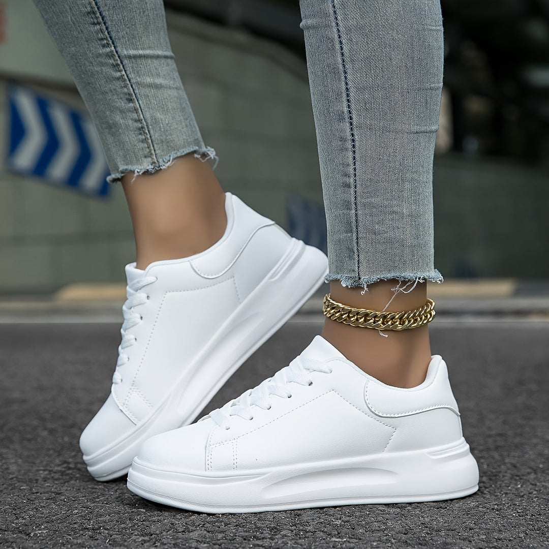Minimalist white leather casual footwear for women, designed for ultimate comfort and versatility.